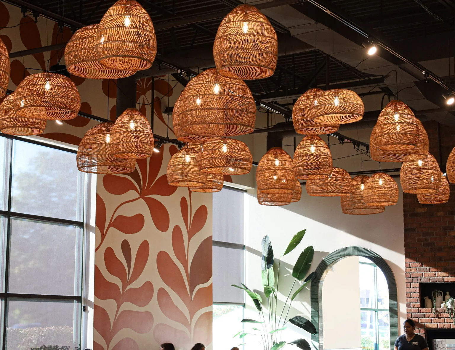 Stylish restaurant interior with woven pendant lights