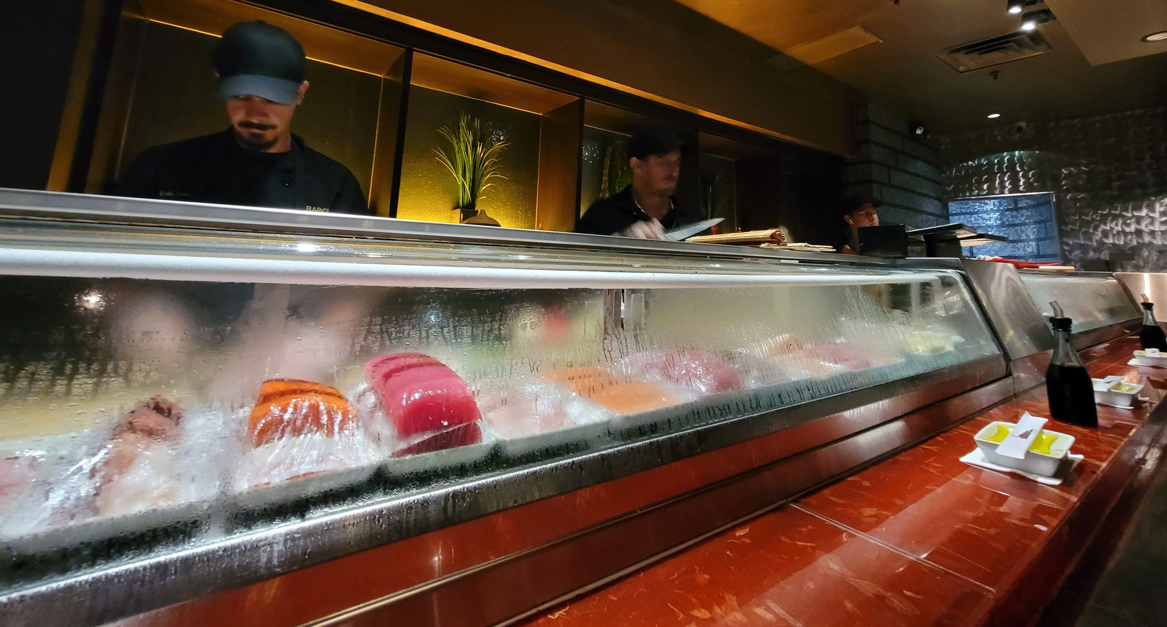 Sushi chefs preparing fresh sushi at a Japanese restaurant