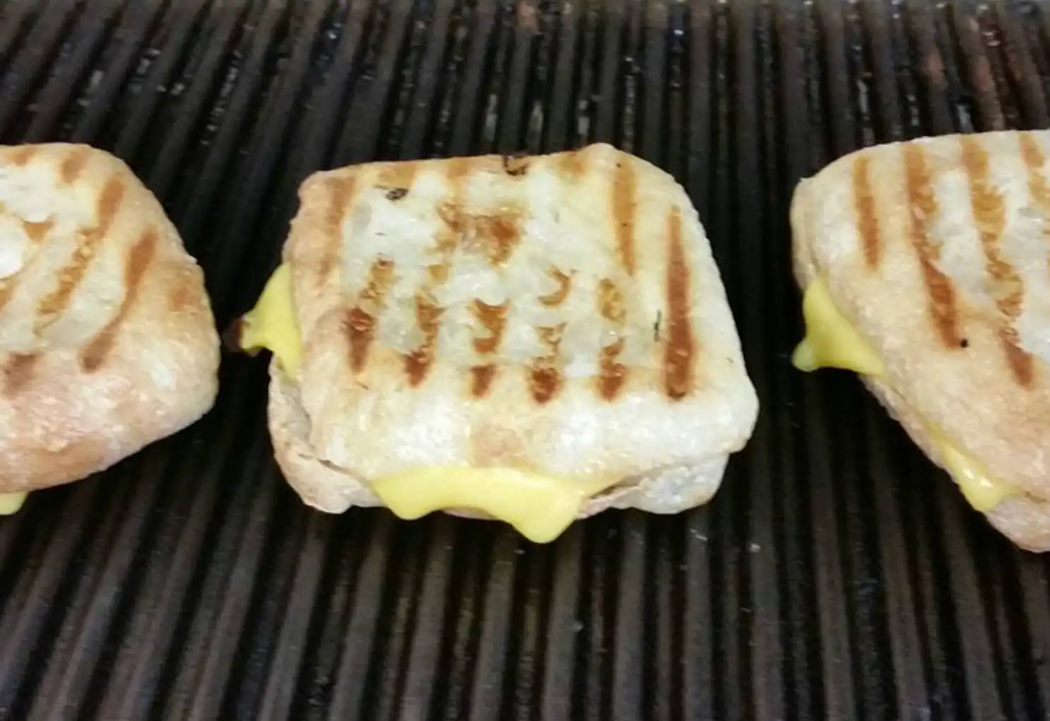Ooey and gooey grilled cheese is a favorite at Subito - build your own with any combination of meats and cheese.