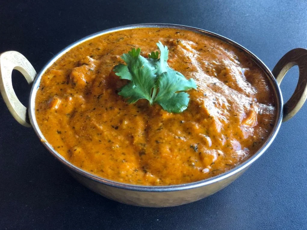 Creamy Indian butter chicken in a traditional bowl