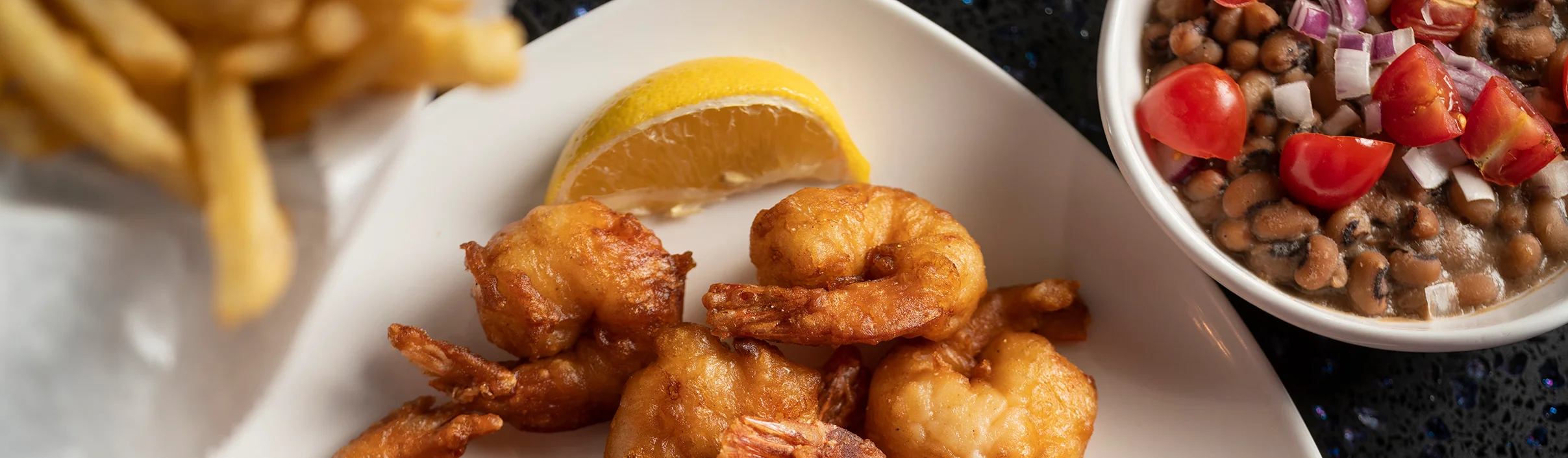 Crispy fried shrimp served with lemon, a classic seafood dish