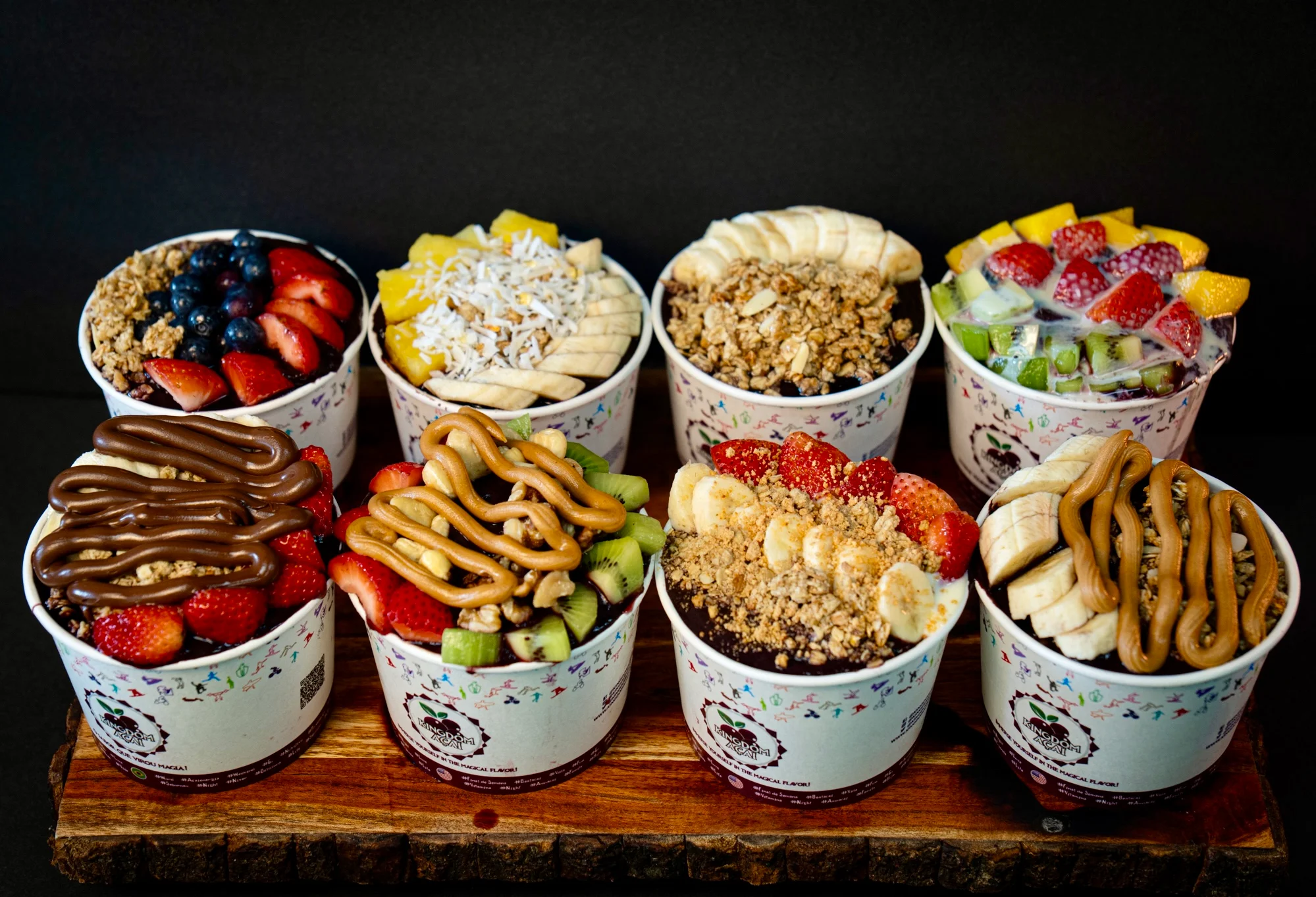 Colorful acai bowls with fresh fruits and granola