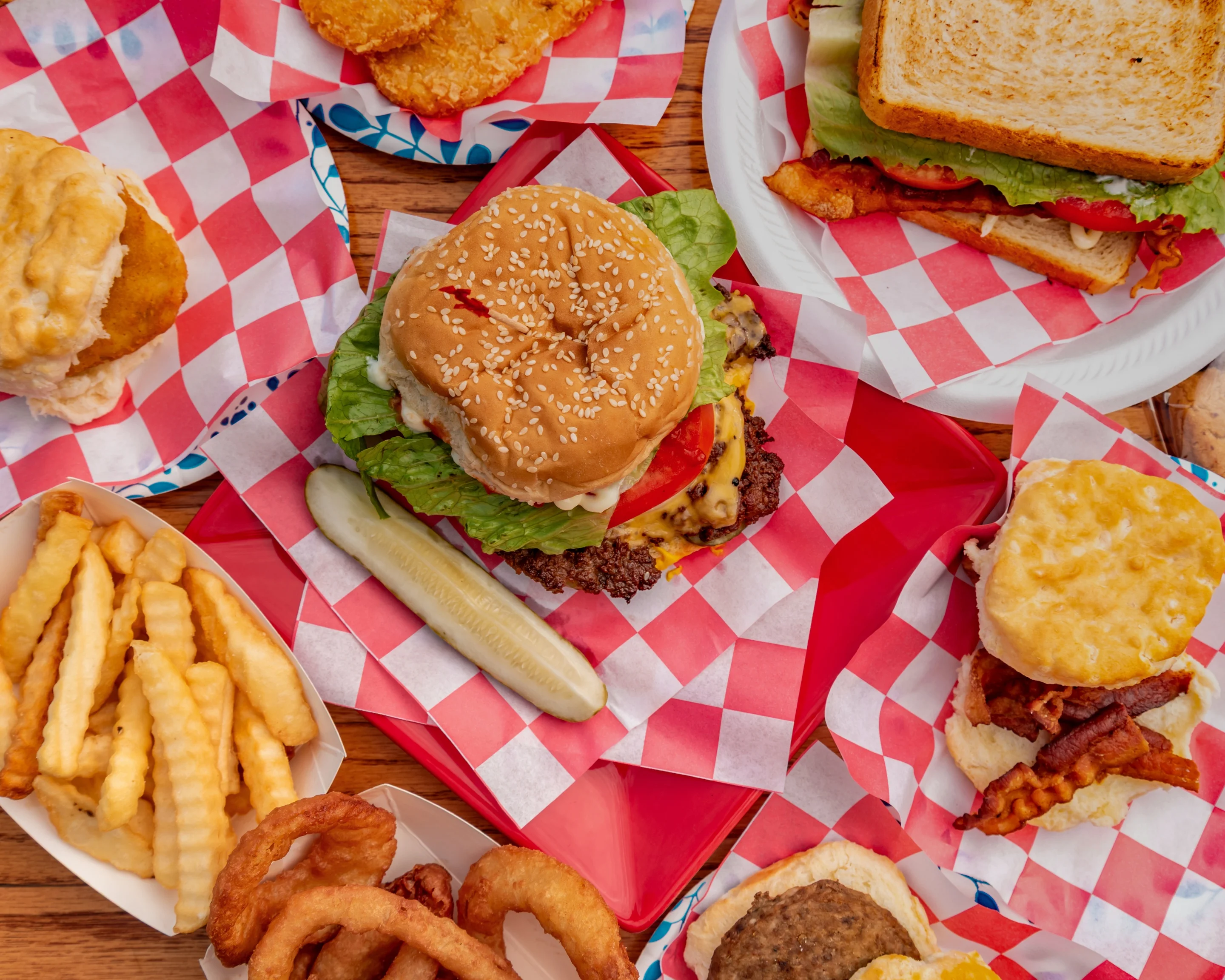 Classic American cheeseburger with fries and sides