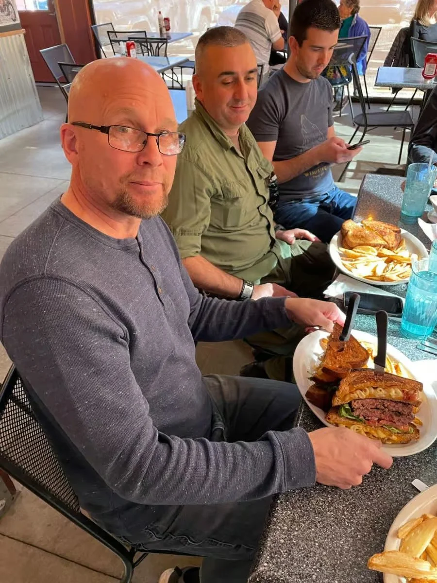 Hearty American cheeseburger with fries in a casual dining setting