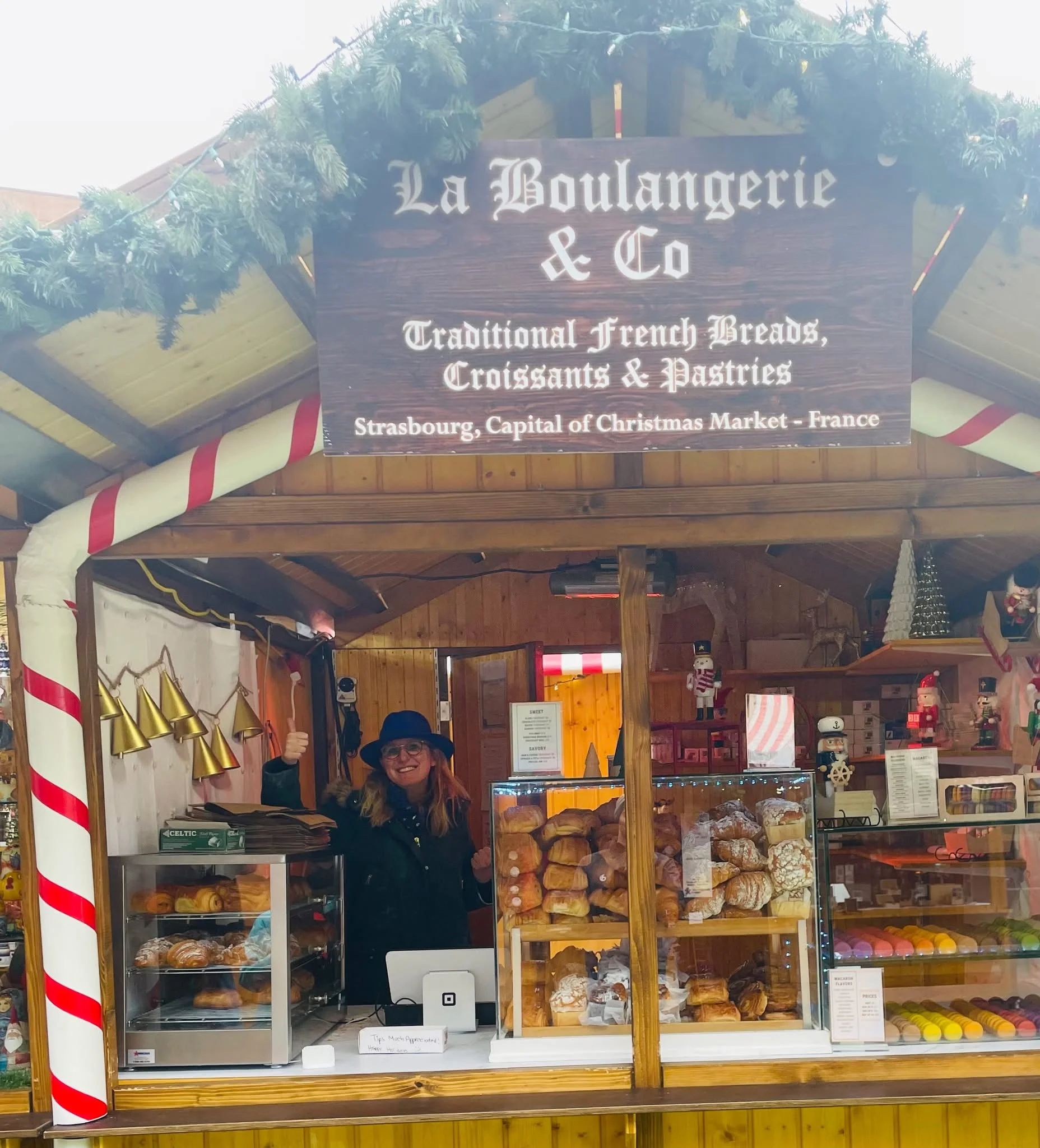 French bakery stall with pastries at a festive Christmas market
