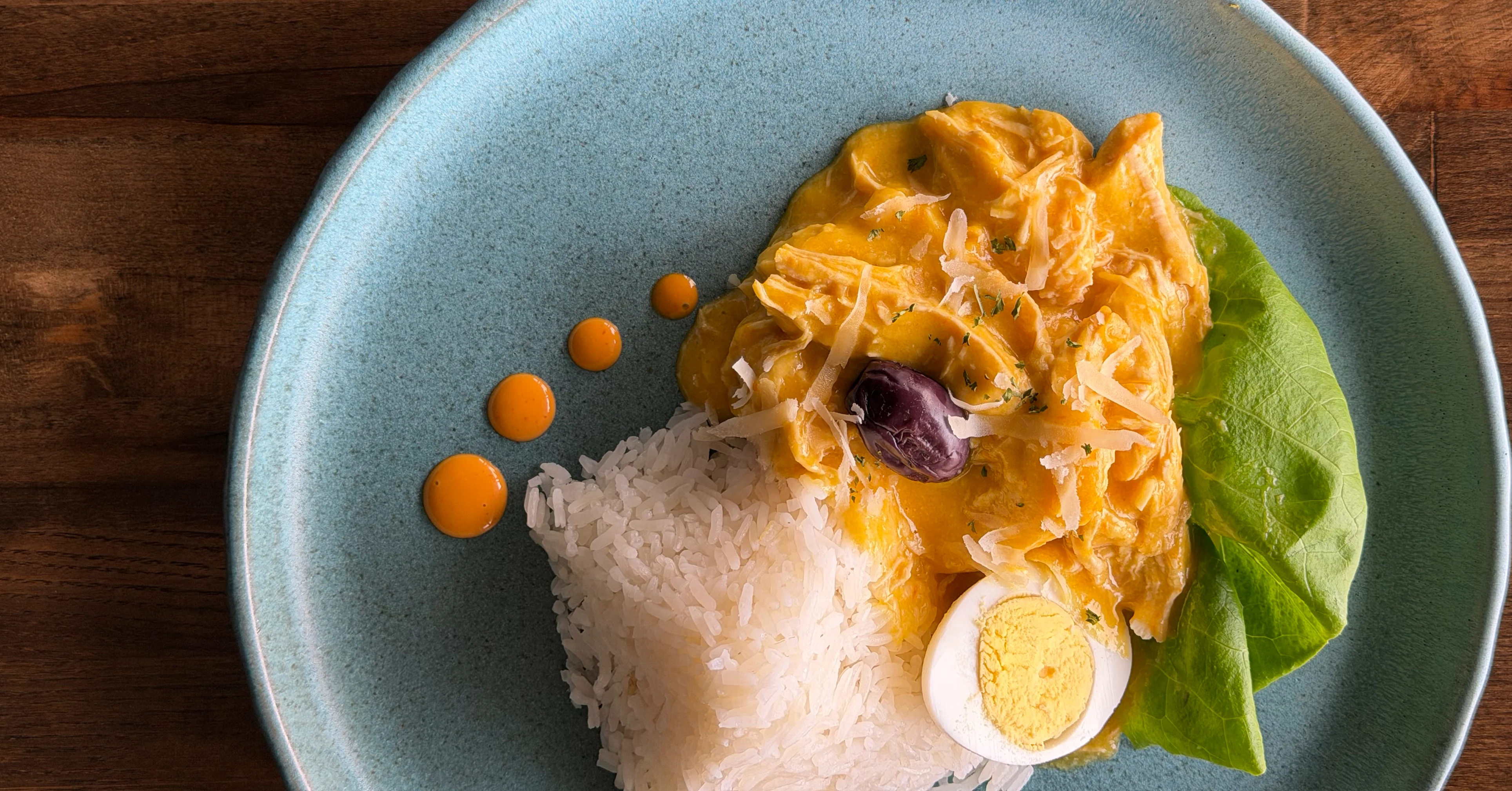 Peruvian aji de gallina served with rice and boiled egg