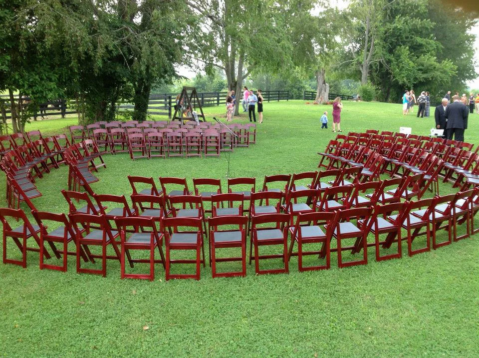 Outdoor wedding setup with circular seating arrangement