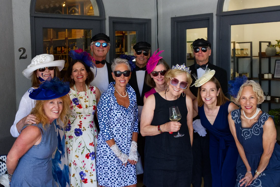 Group of elegantly dressed guests at a festive gathering