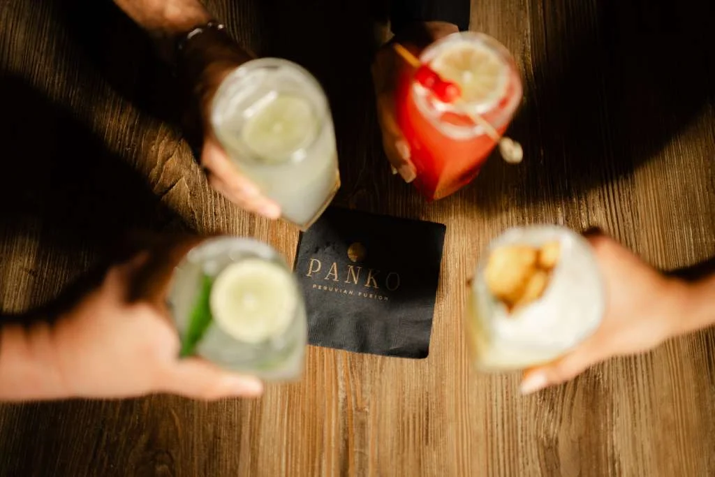 Colorful cocktails at Panko restaurant on a wooden table