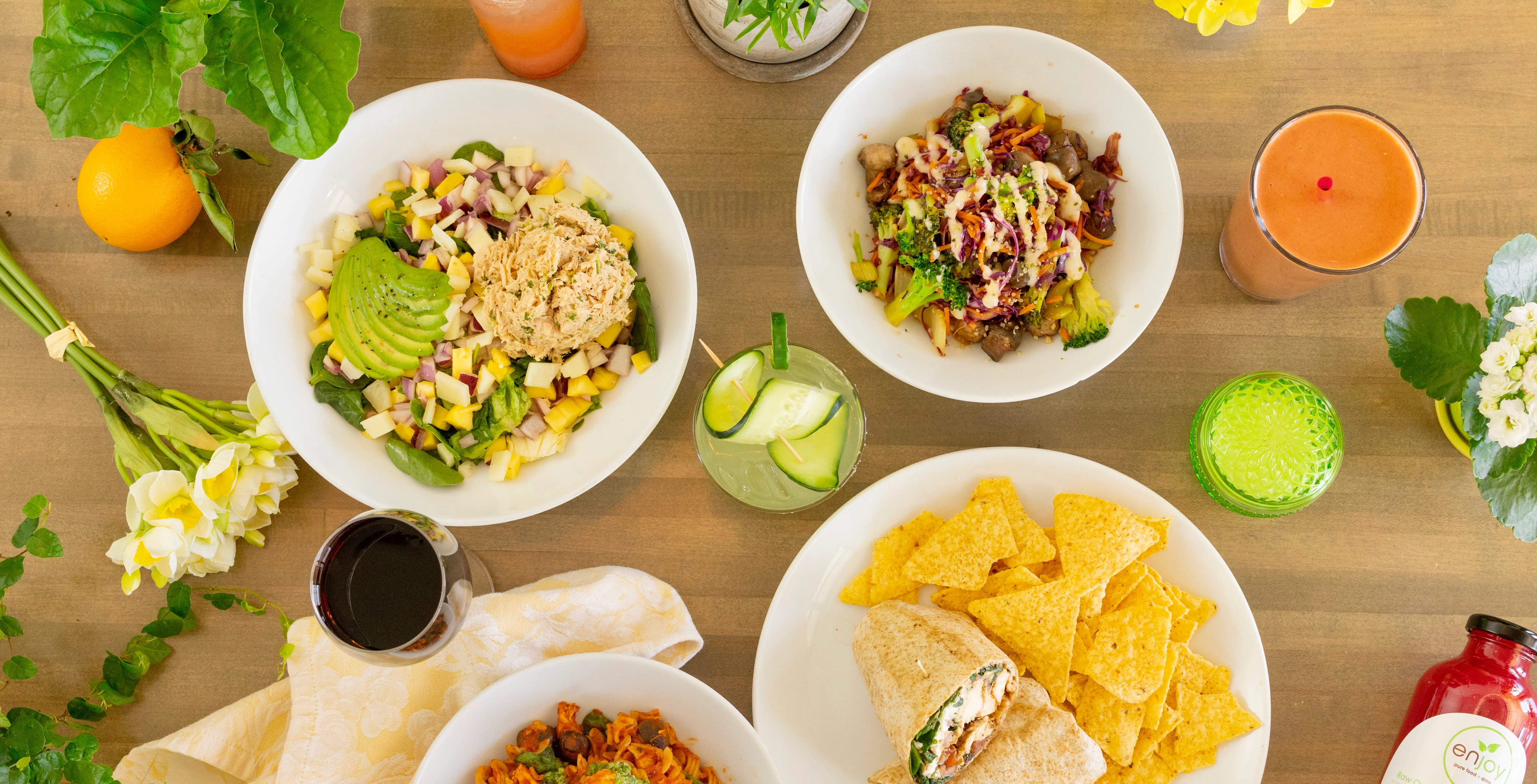 Colorful salad bowls and wraps in a vibrant dining setting