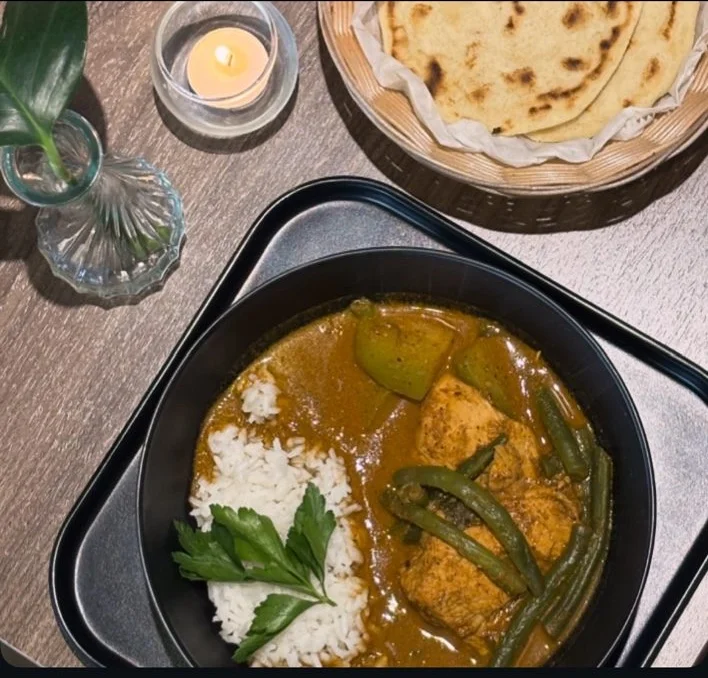 Delicious Indian curry with rice and naan bread