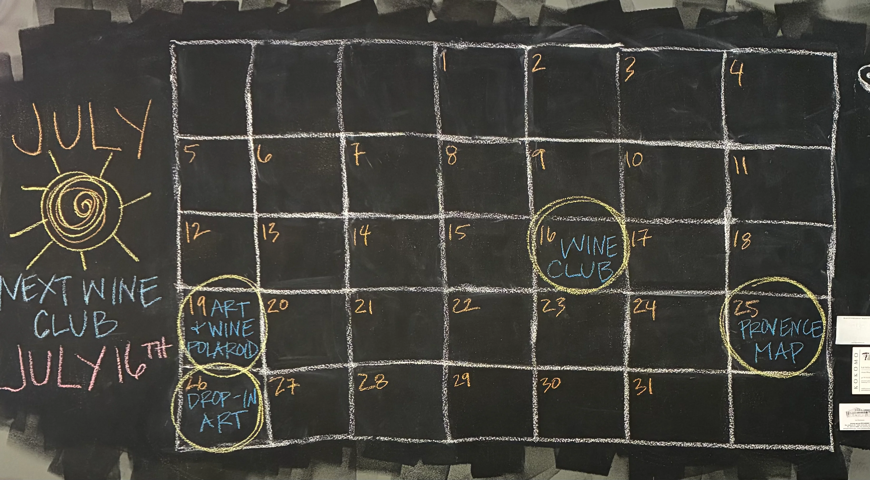 Chalkboard calendar for wine and art events in June and July