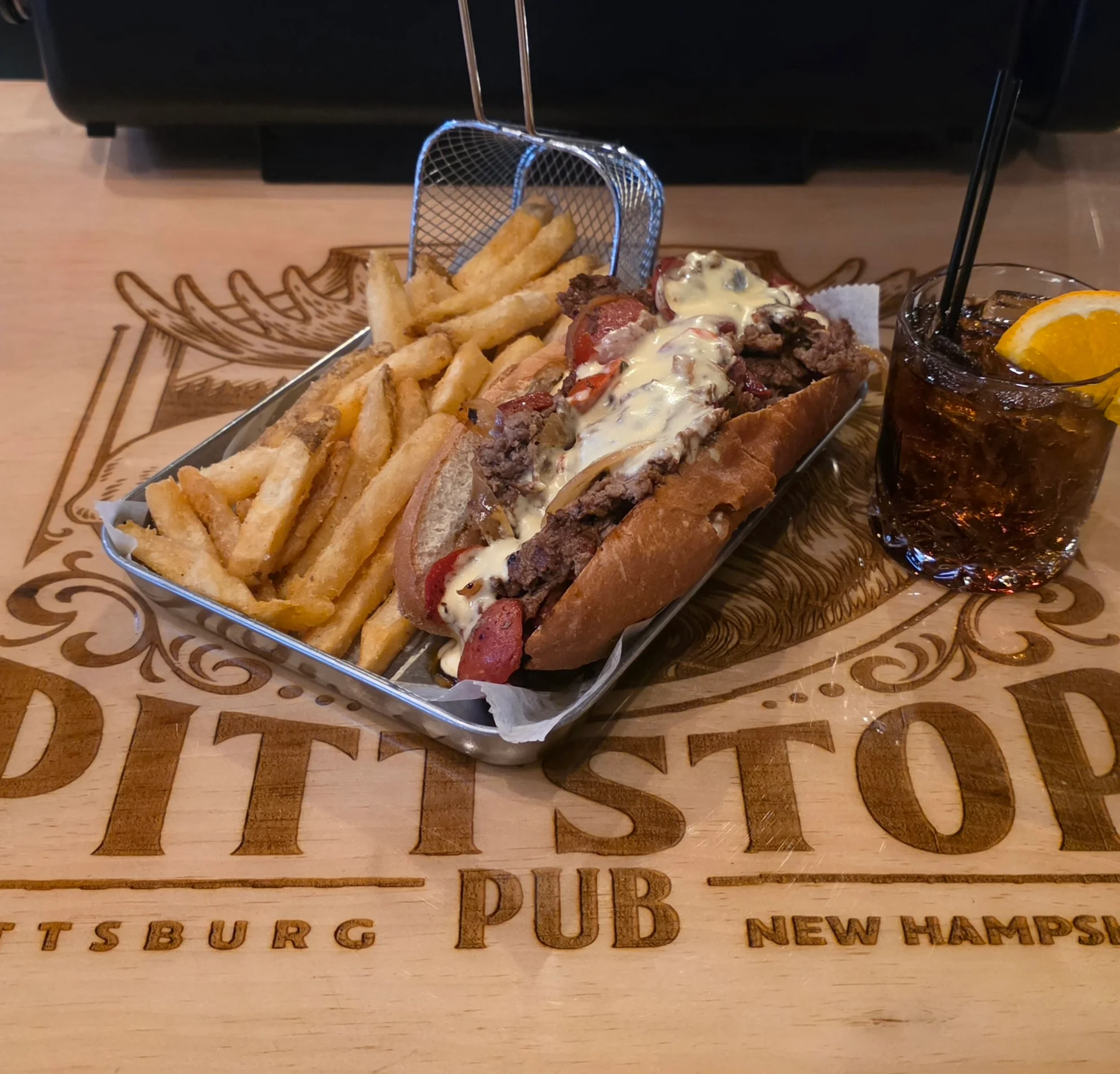 Delicious gourmet burger with fresh toppings on a wooden table