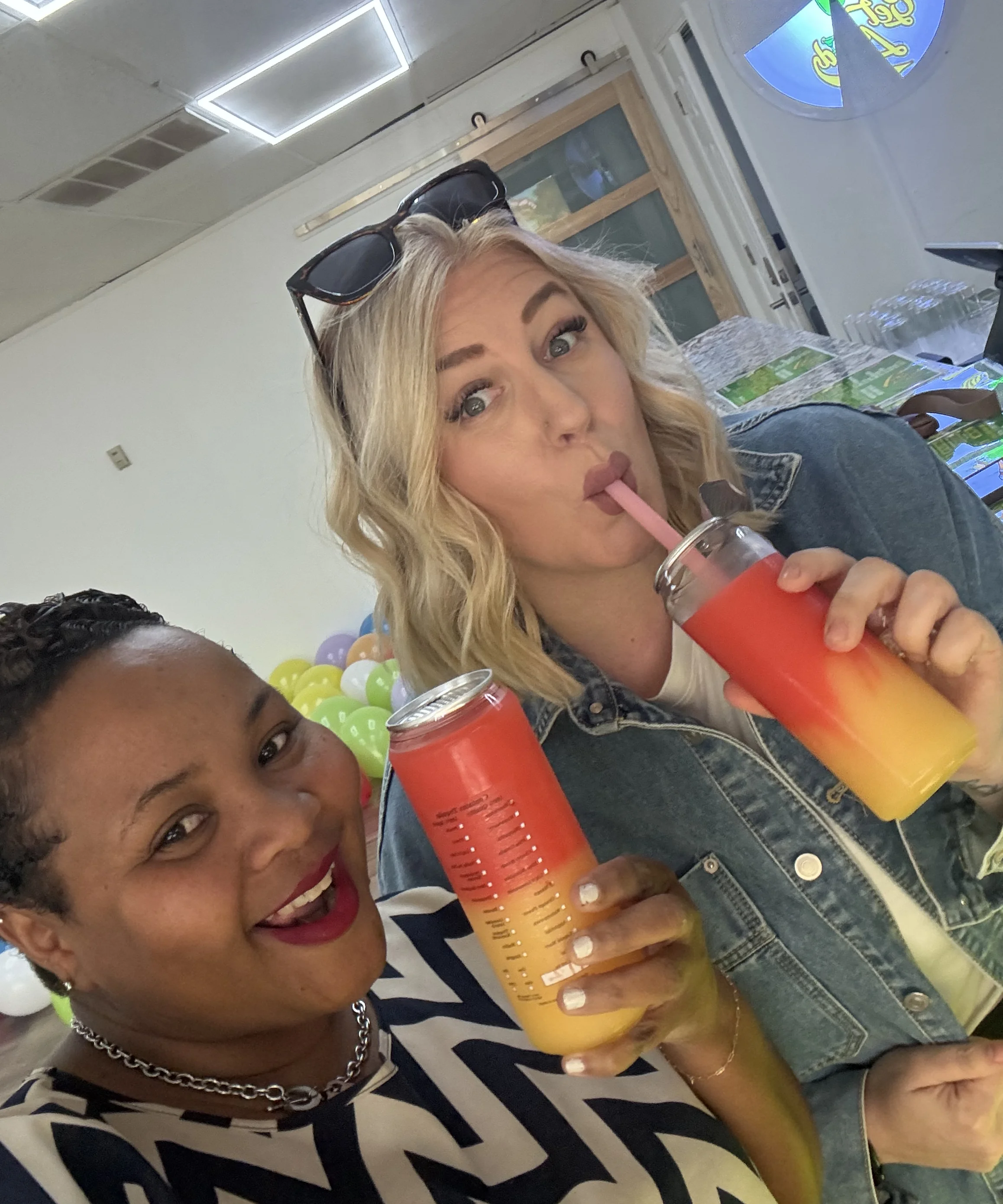 Friends celebrating football season with drinks outside a store
