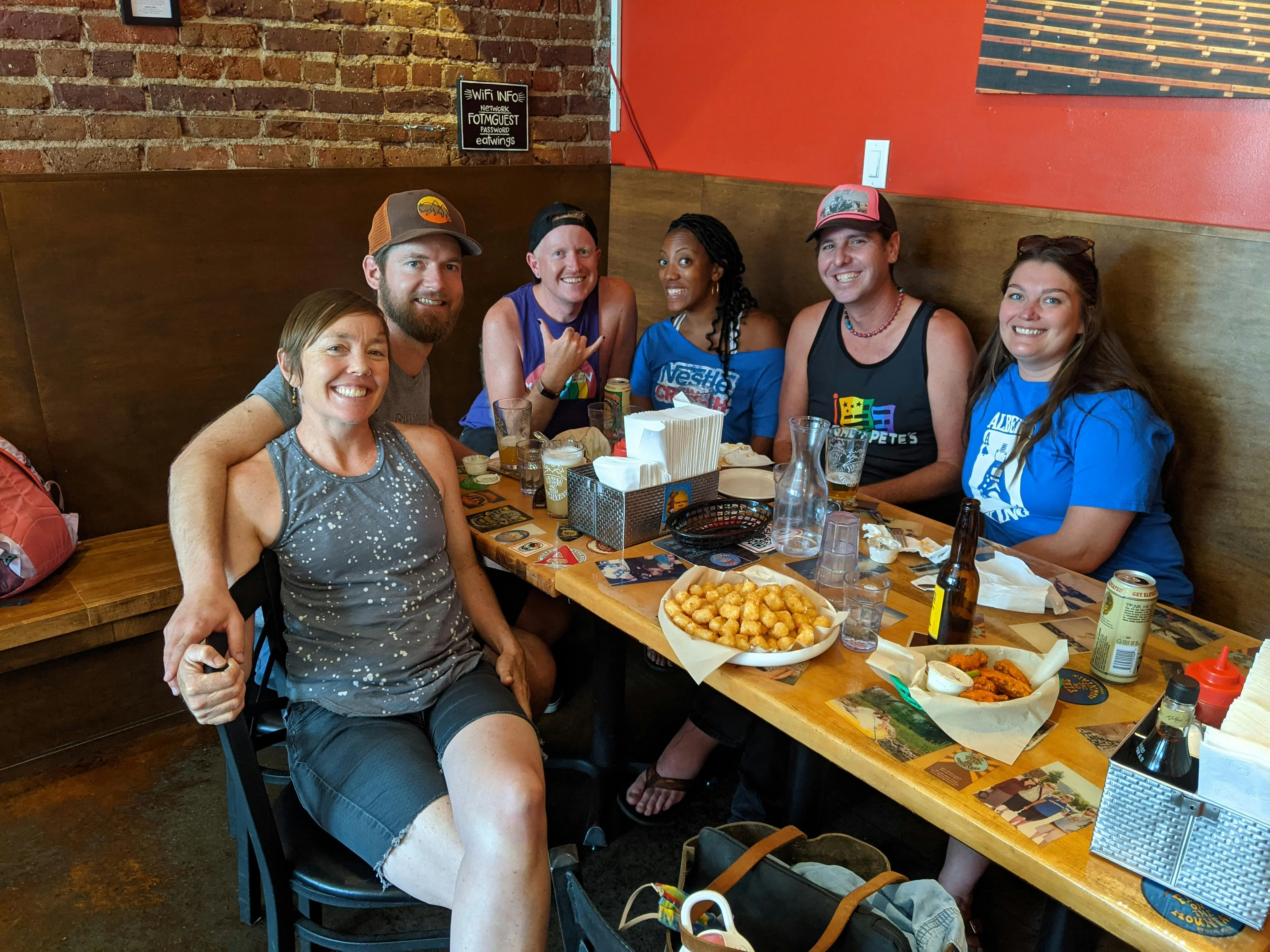 Group of friends enjoying a meal in a cozy restaurant setting