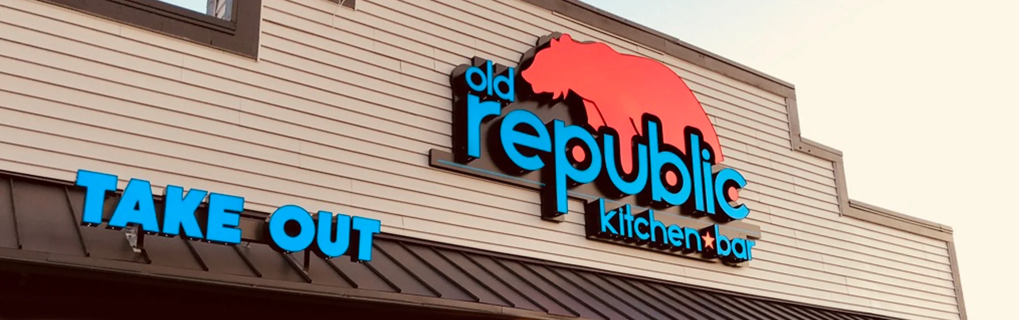 Exterior view of Old Republic Kitchen & Bar with takeout sign