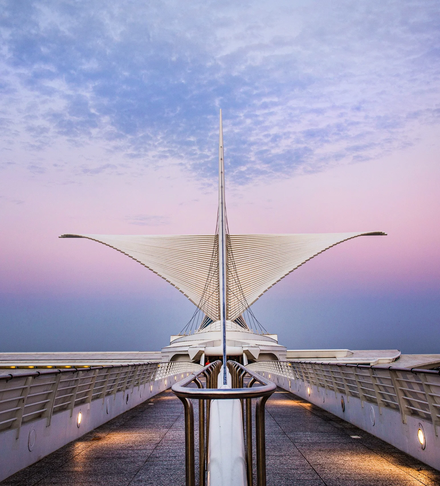 Milwaukee Art Museum exterior at night, showcasing its stunning architecture.