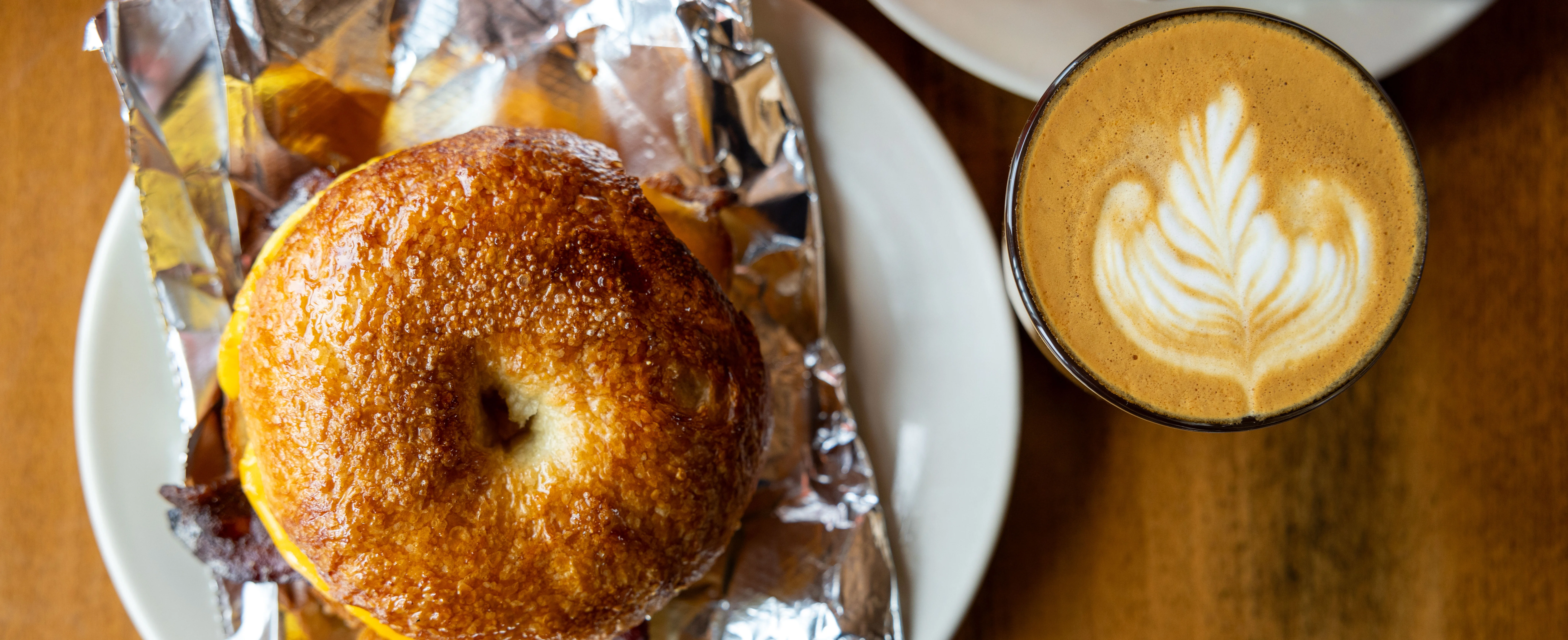 Freshly toasted bagel sandwich with coffee