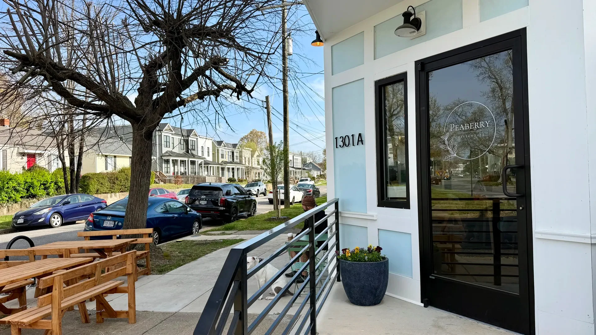 Charming coffeehouse entrance with outdoor seating