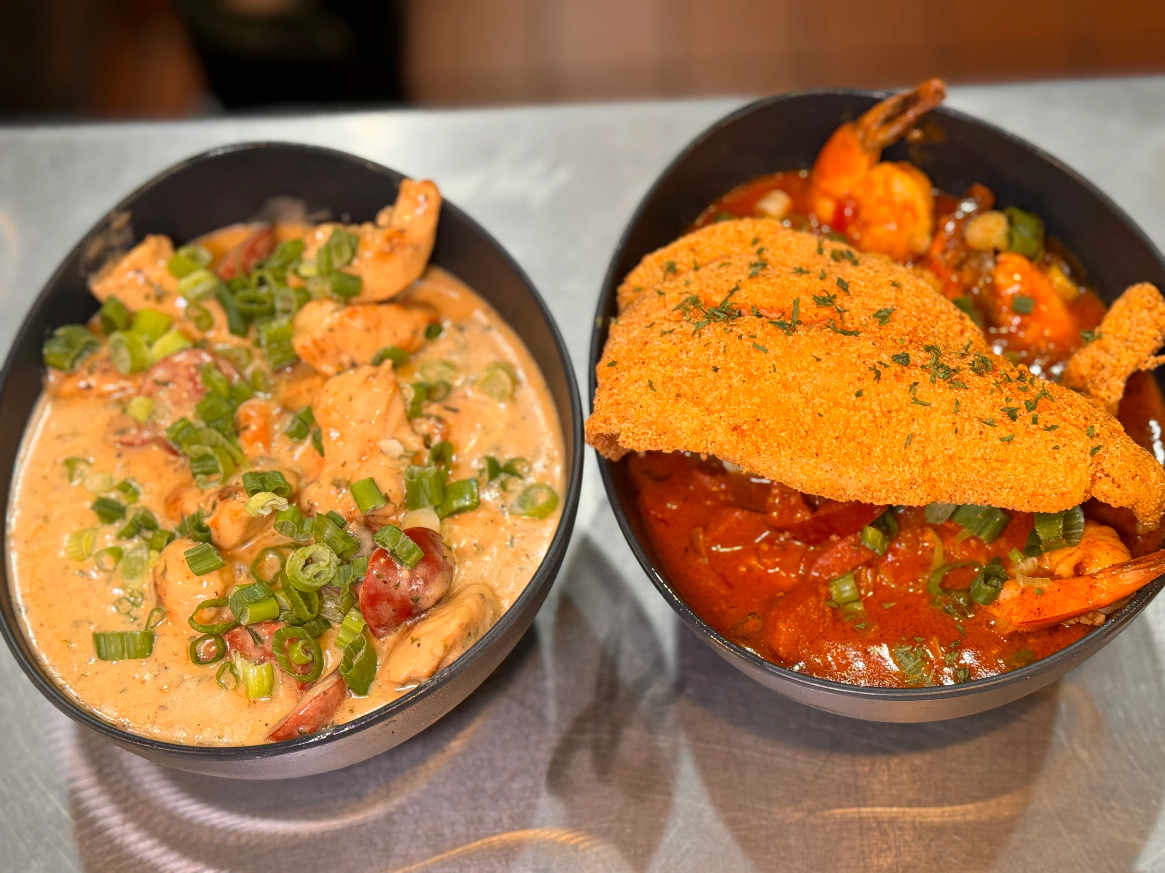 Southern-style shrimp and grits with fried catfish in a rich sauce