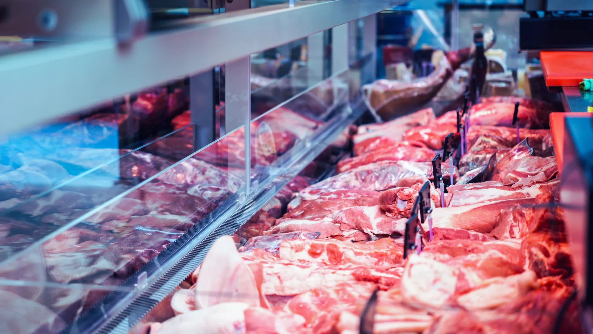 Fresh cuts of meat displayed in a butcher shop