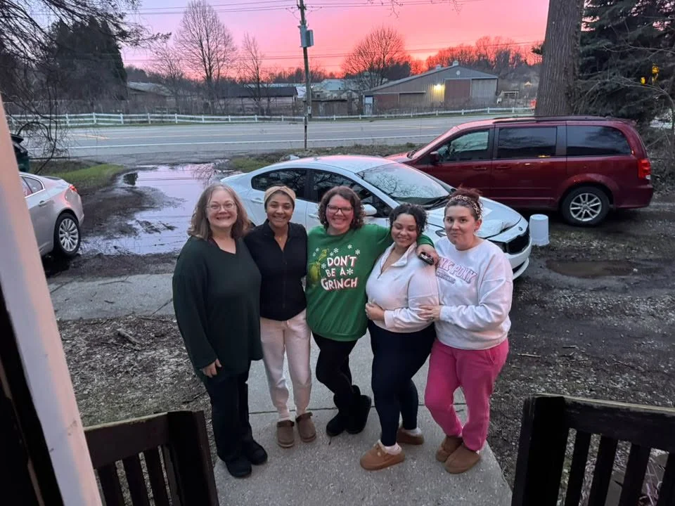 Group of friends enjoying a sunset outside a restaurant