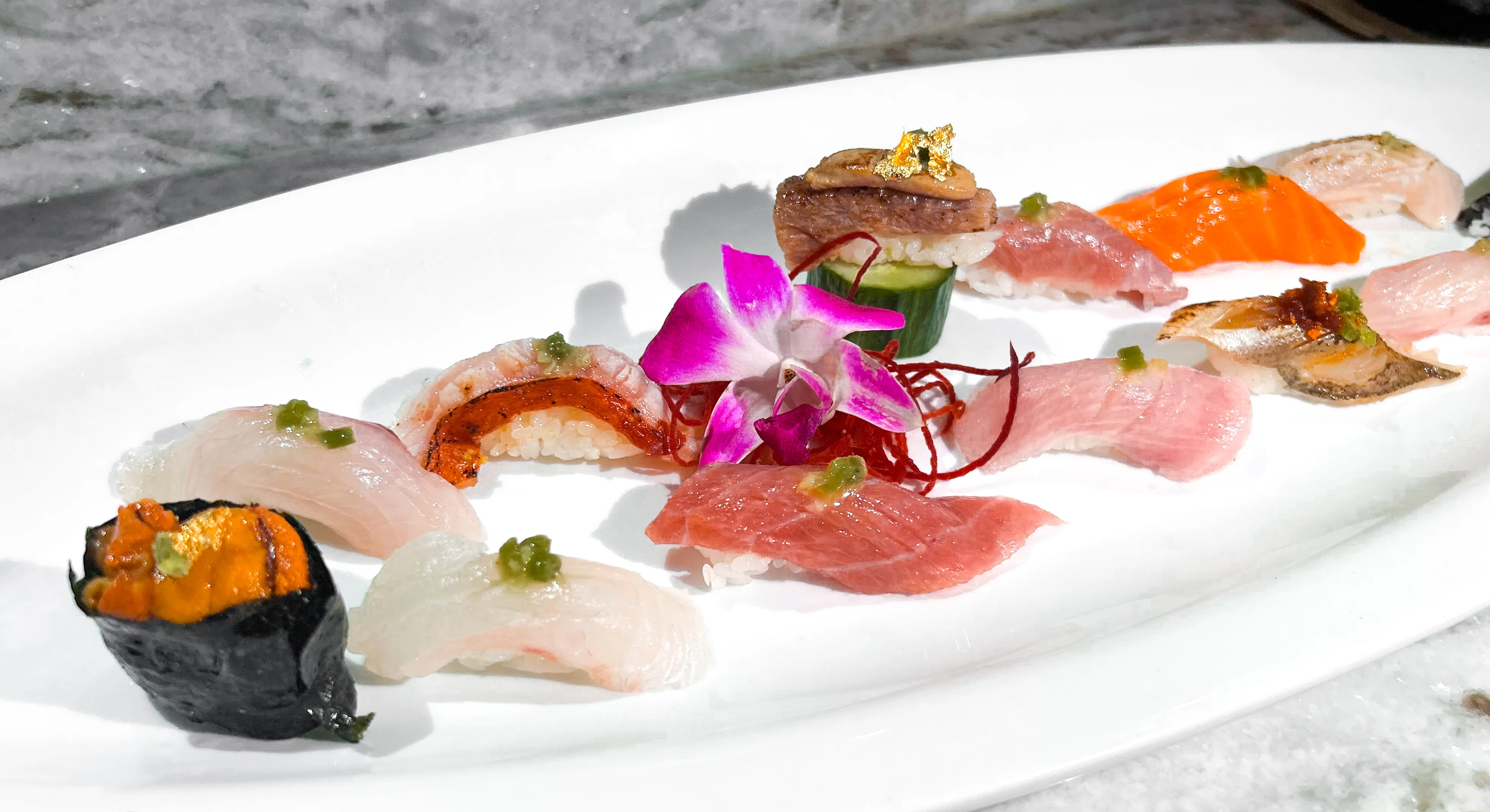 Artfully arranged sushi platter showcasing various types of nigiri