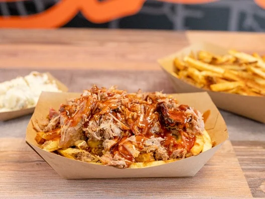 Delicious gourmet burger with fresh toppings on a wooden table