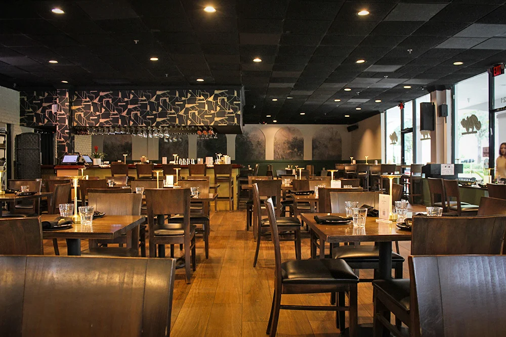 Modern restaurant interior with wooden tables and stylish decor