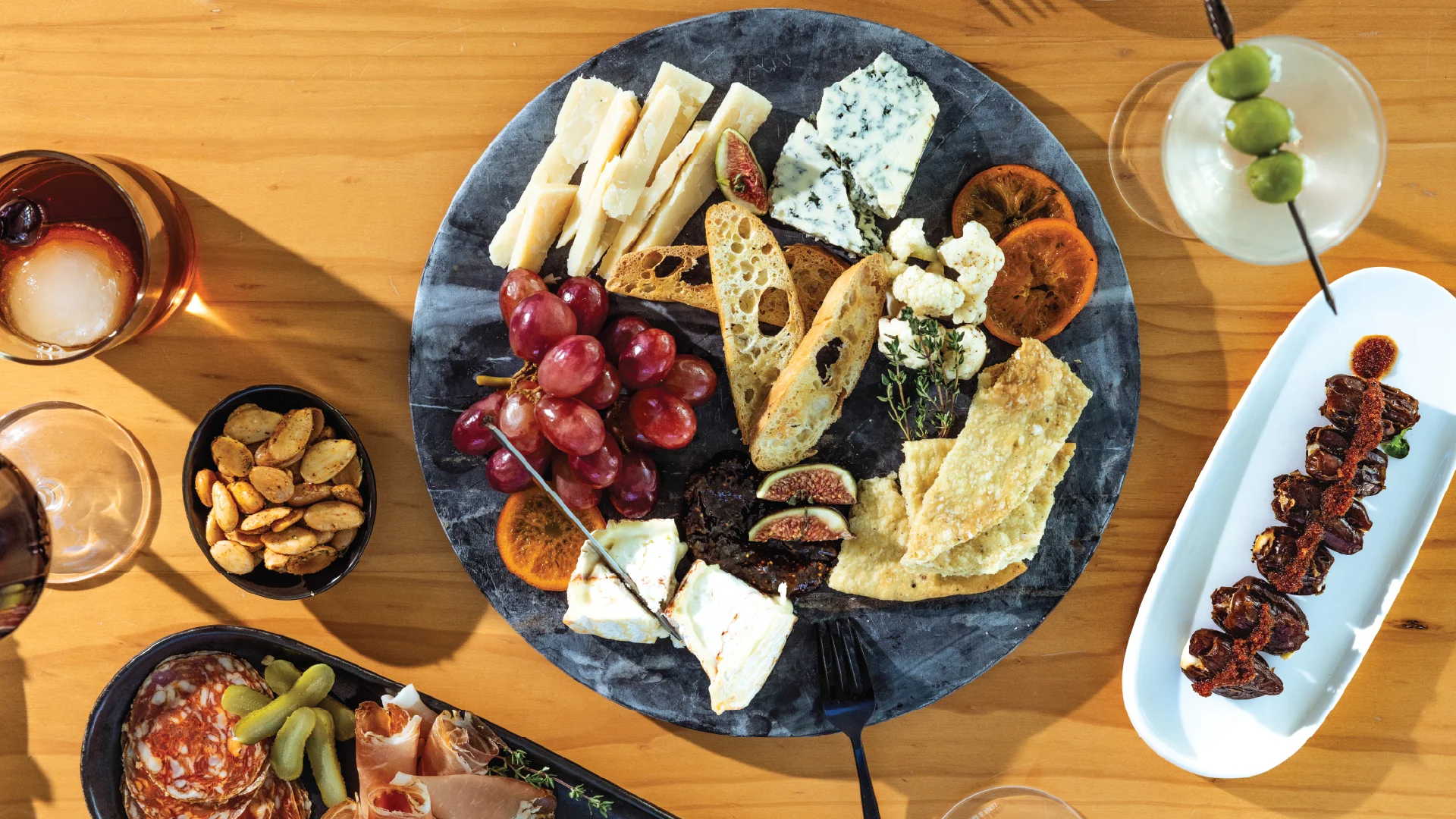 Artisanal cheese platter with fruits and nuts