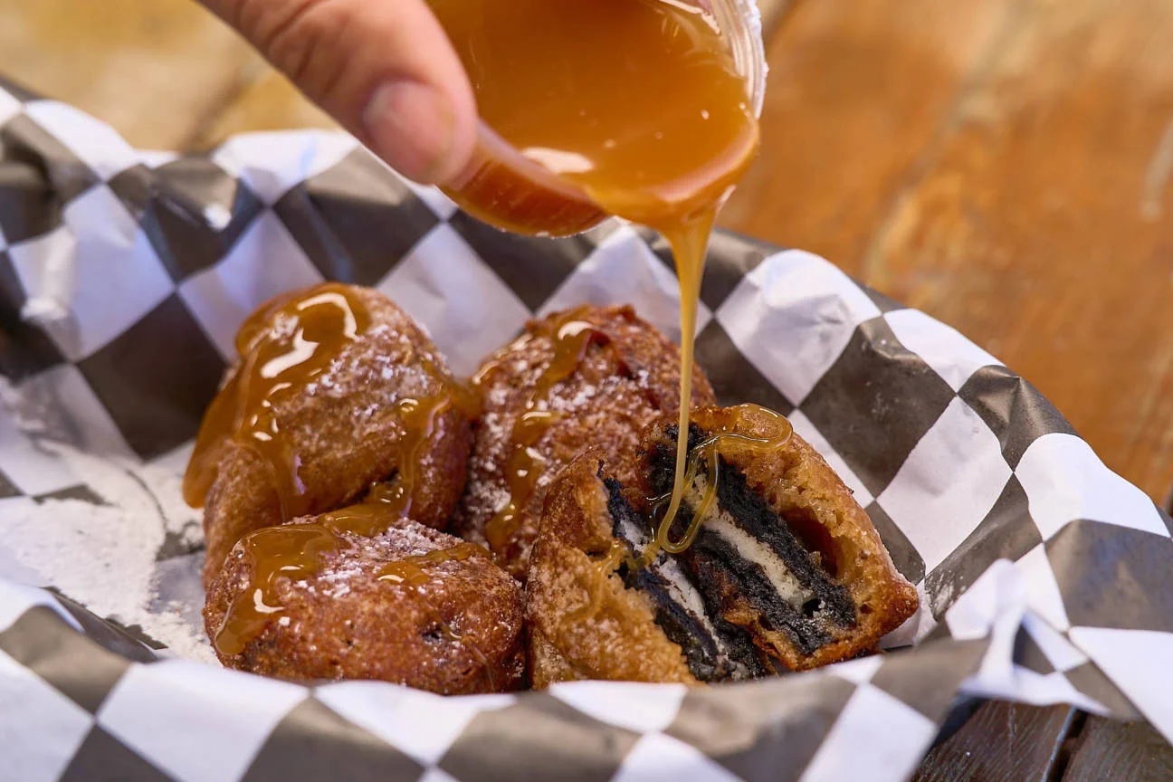Deep-fried Oreos drizzled with caramel sauce