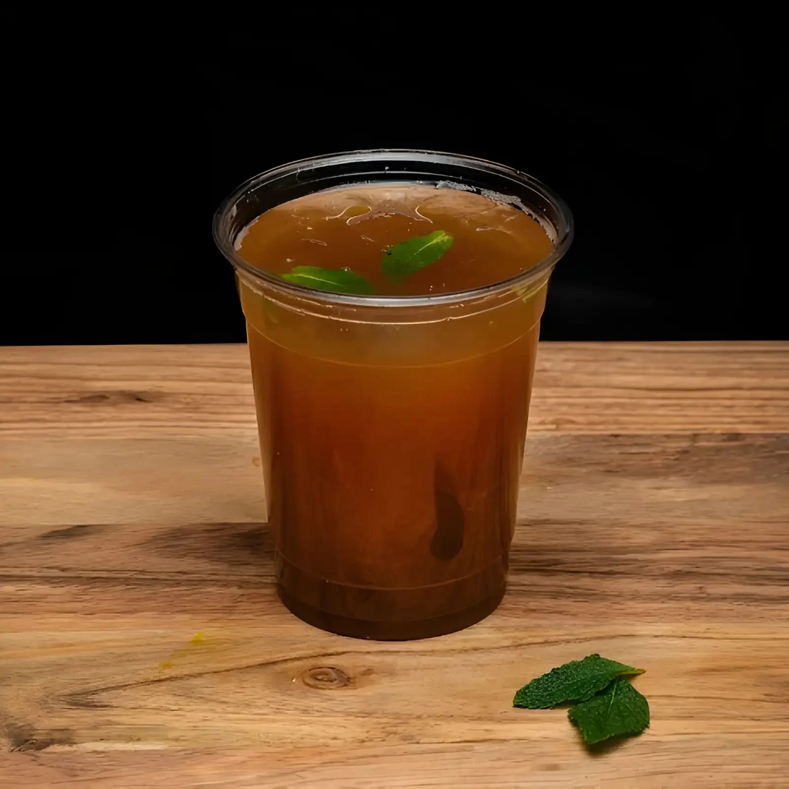 Refreshing iced tea with mint garnish in a clear cup
