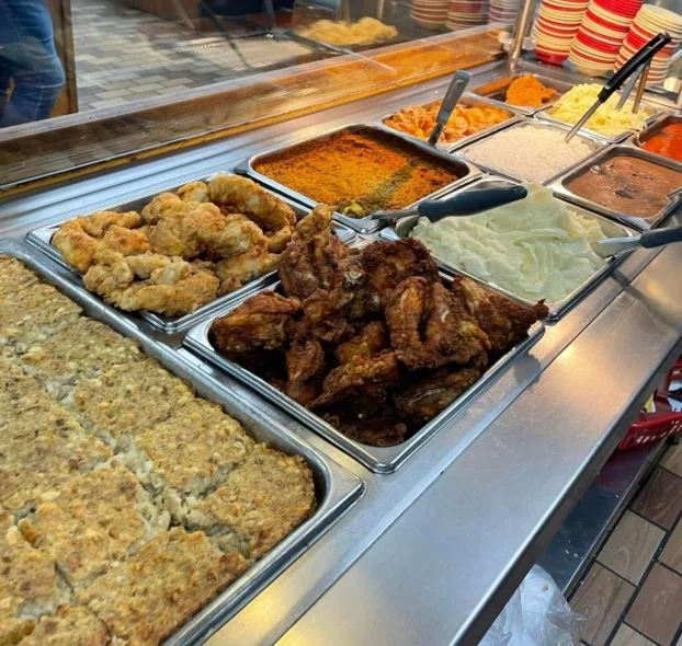 Southern fried chicken with sides in a buffet setting