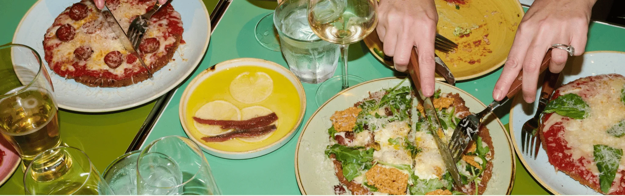 Italian pizza with fresh toppings served in a vibrant restaurant setting