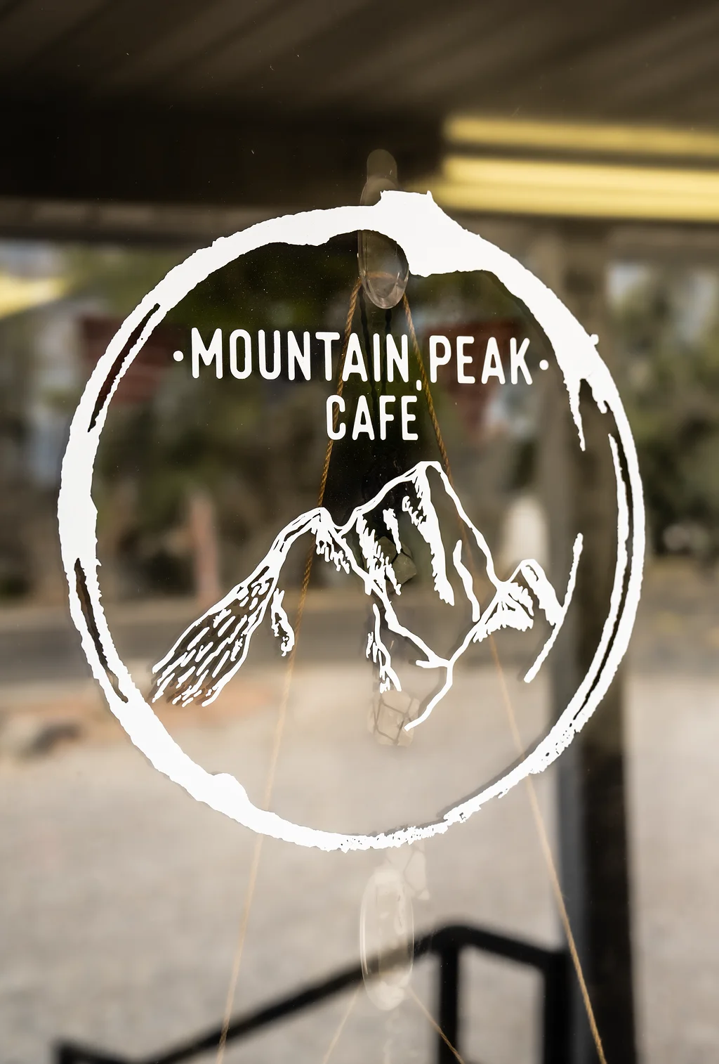 Mountain Peak Cafe logo featuring a mountain design