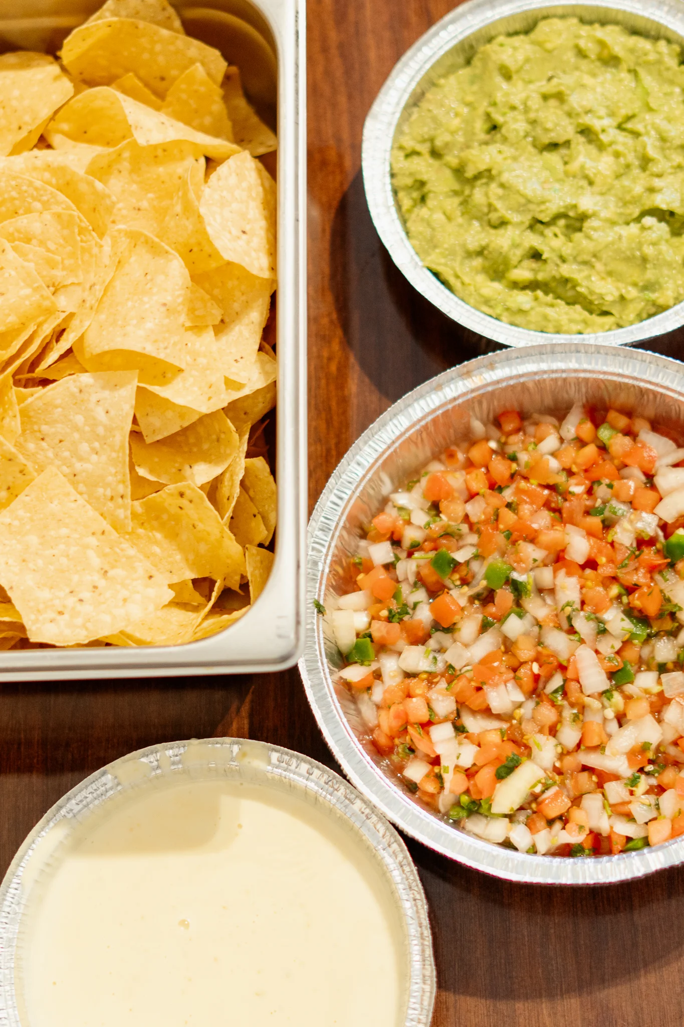 Chips and salsa platter with guacamole and cheese dip