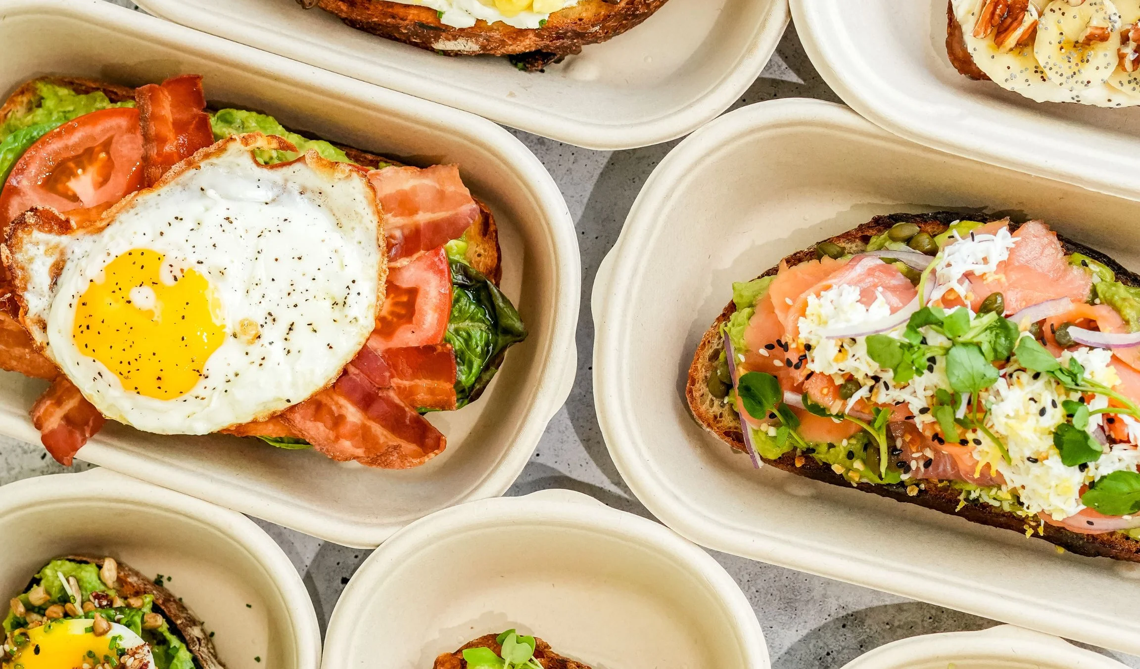 Artisan avocado toast platter with various toppings