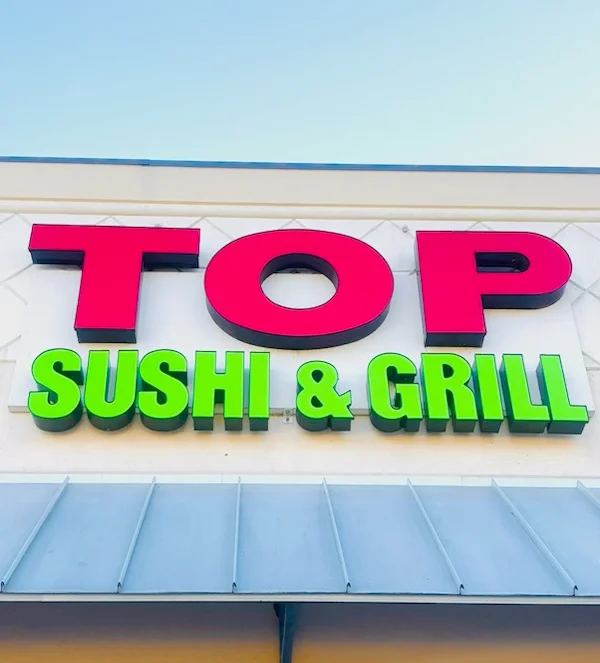Signage for Top Sushi & Grill restaurant