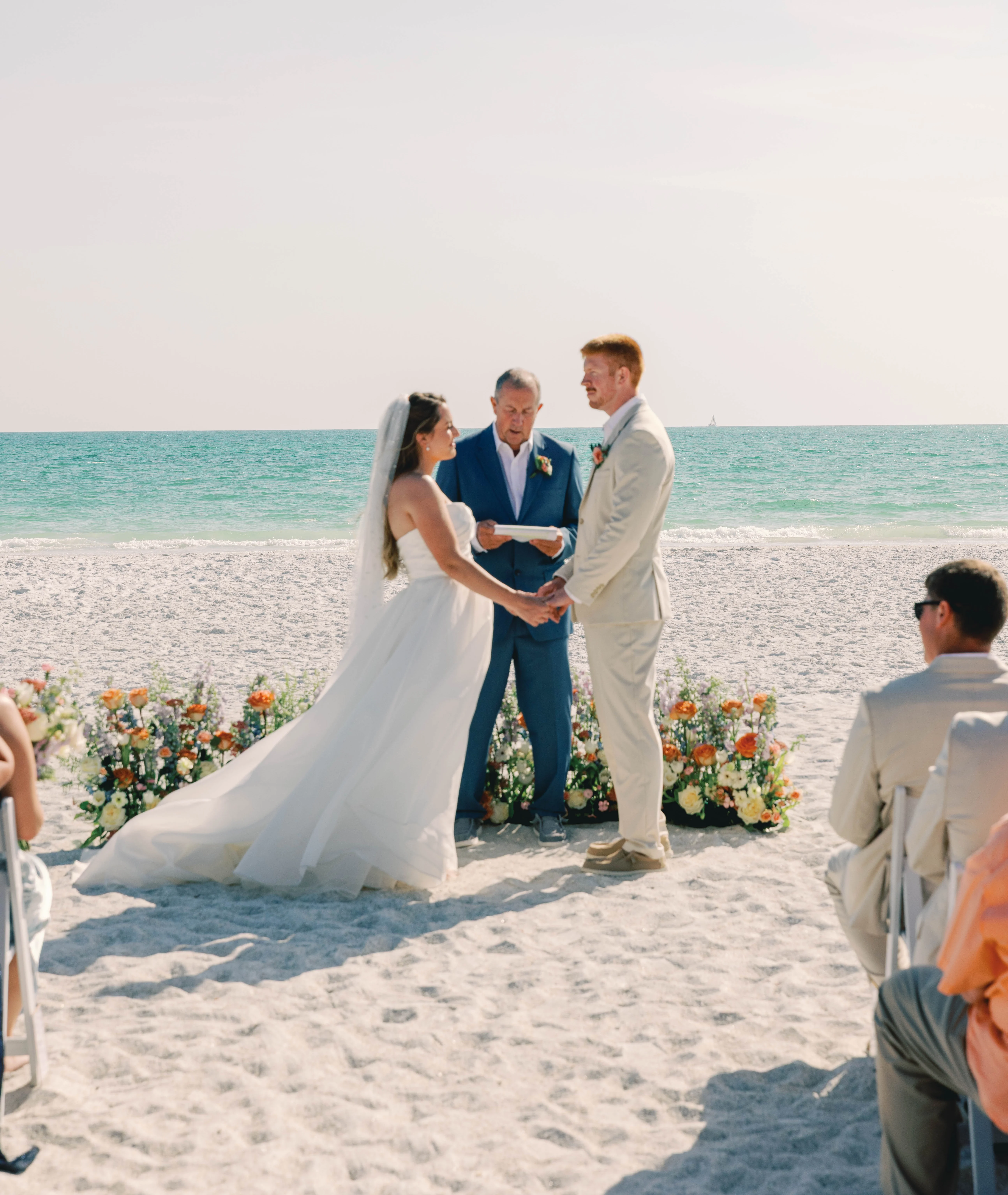 Beach wedding ceremony with ocean backdrop