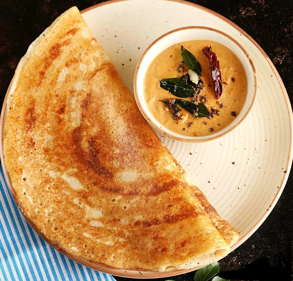 Crispy South Indian dosa served with chutney