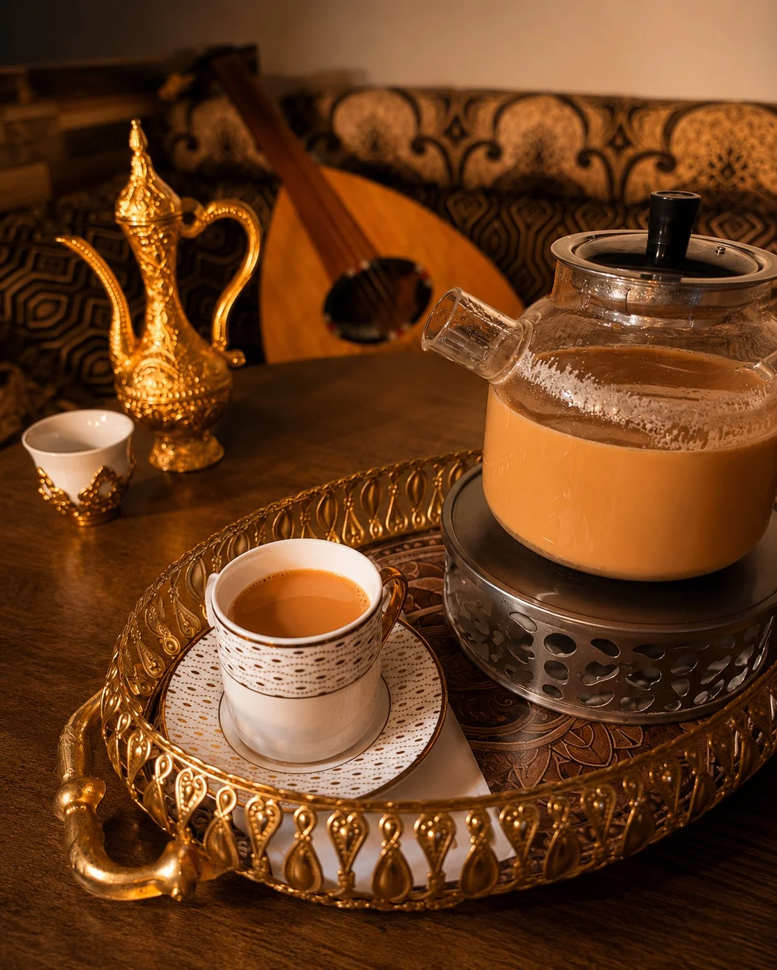 A beautifully arranged tray with tea, a teapot, and decorative items.