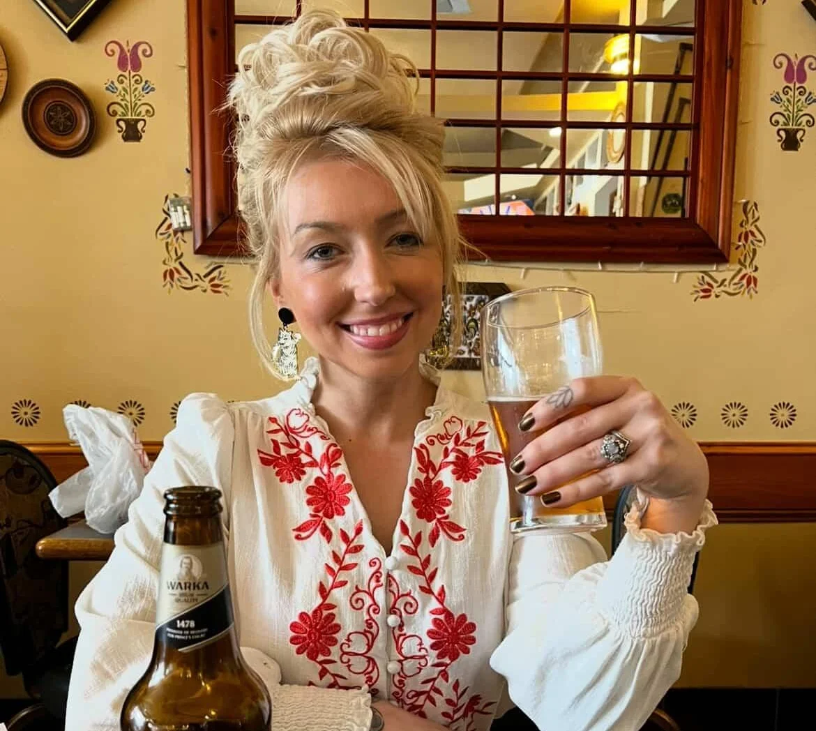 Woman enjoying a drink in a cozy restaurant setting