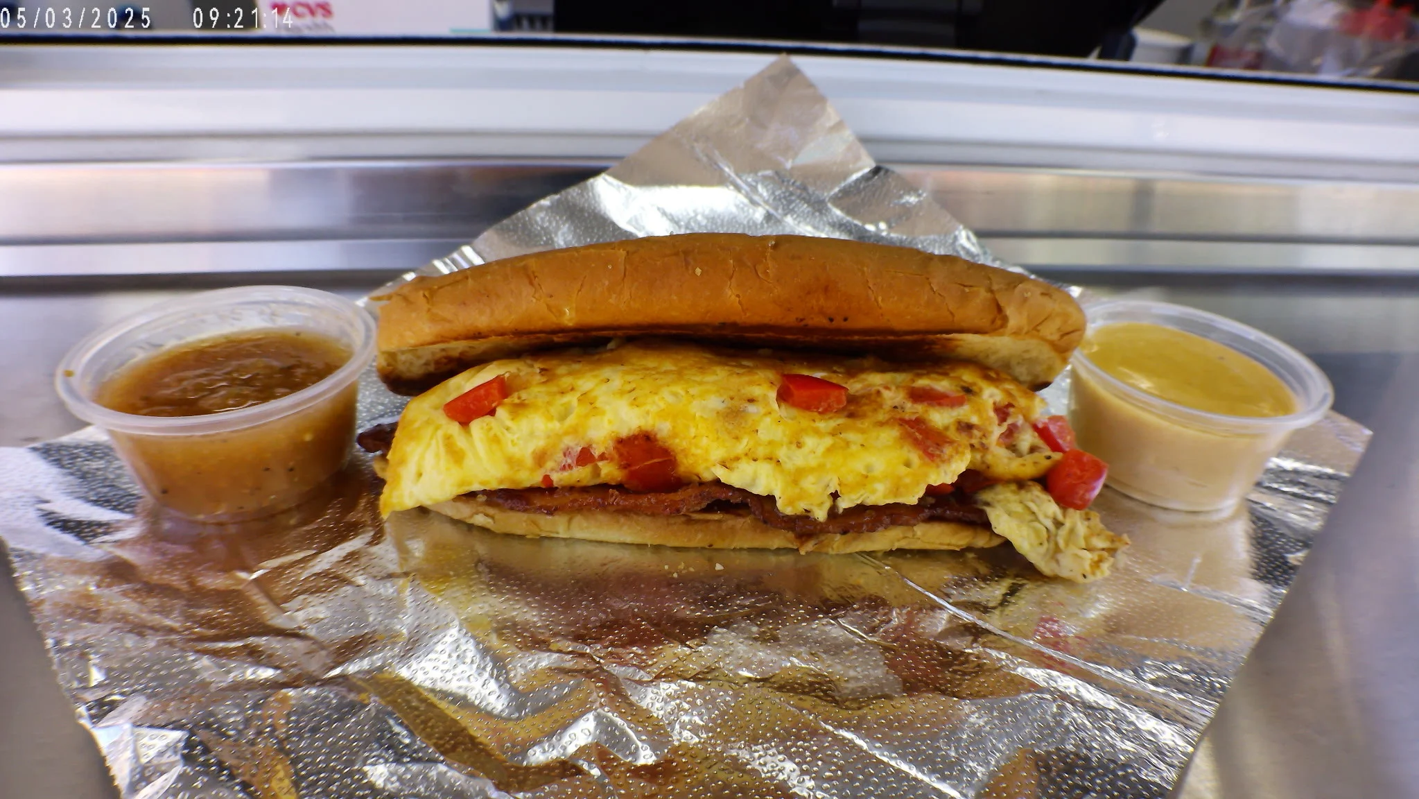 Breakfast sandwich with fluffy omelette in a soft bun