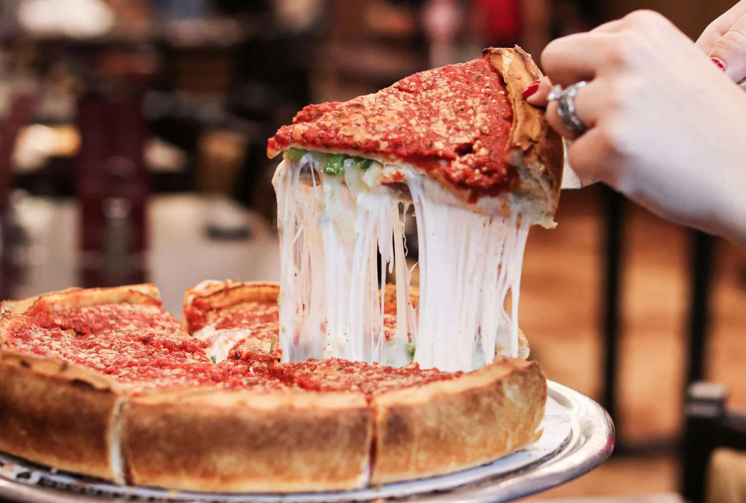 Deep-dish pizza with gooey cheese and rich tomato sauce