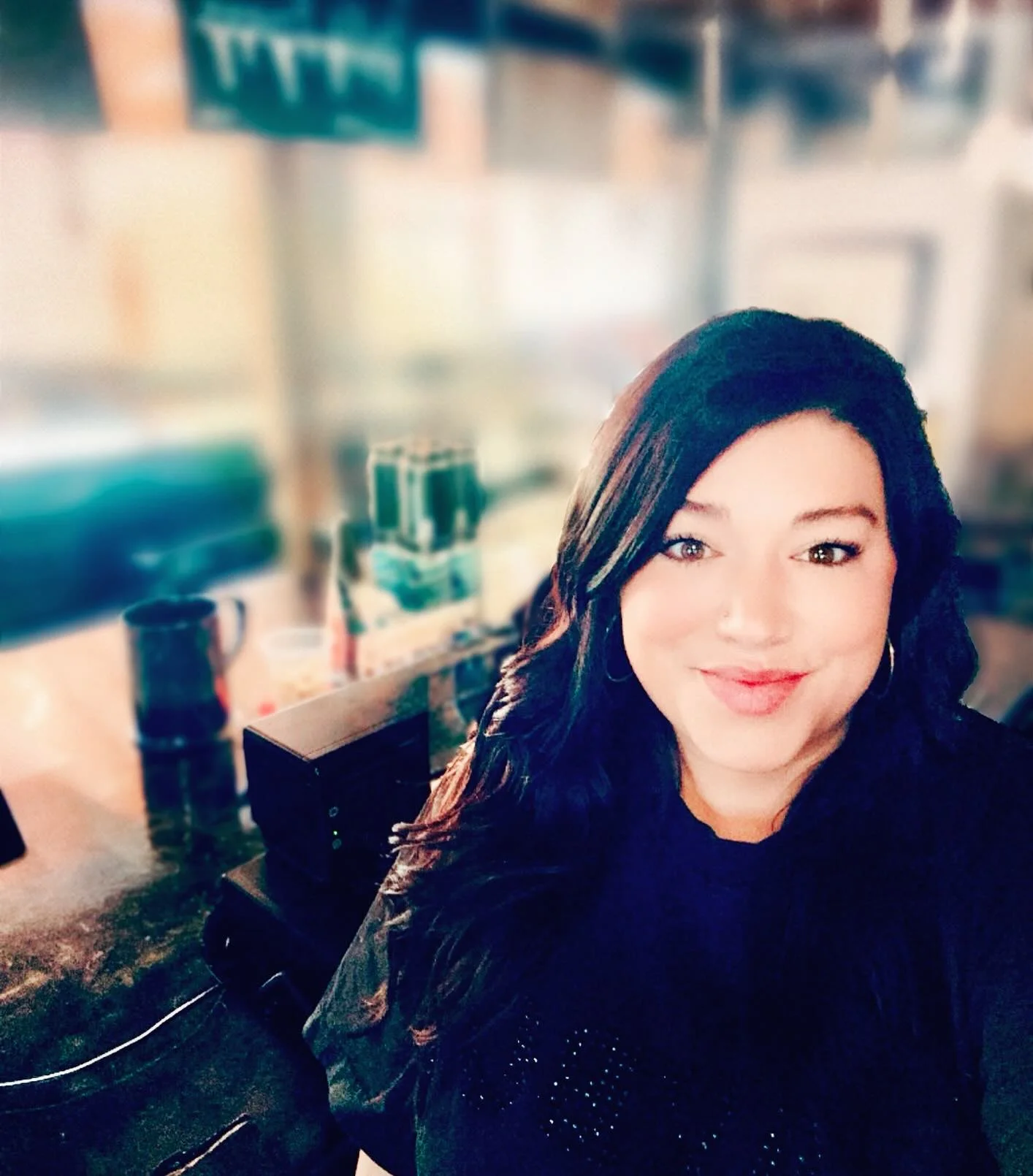 Bartender smiling at a modern bar counter