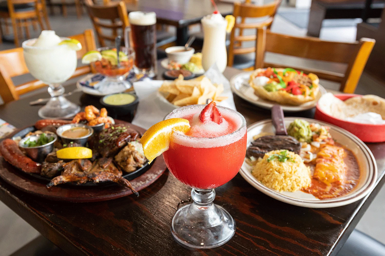 Colorful Mexican feast with cocktails and appetizers