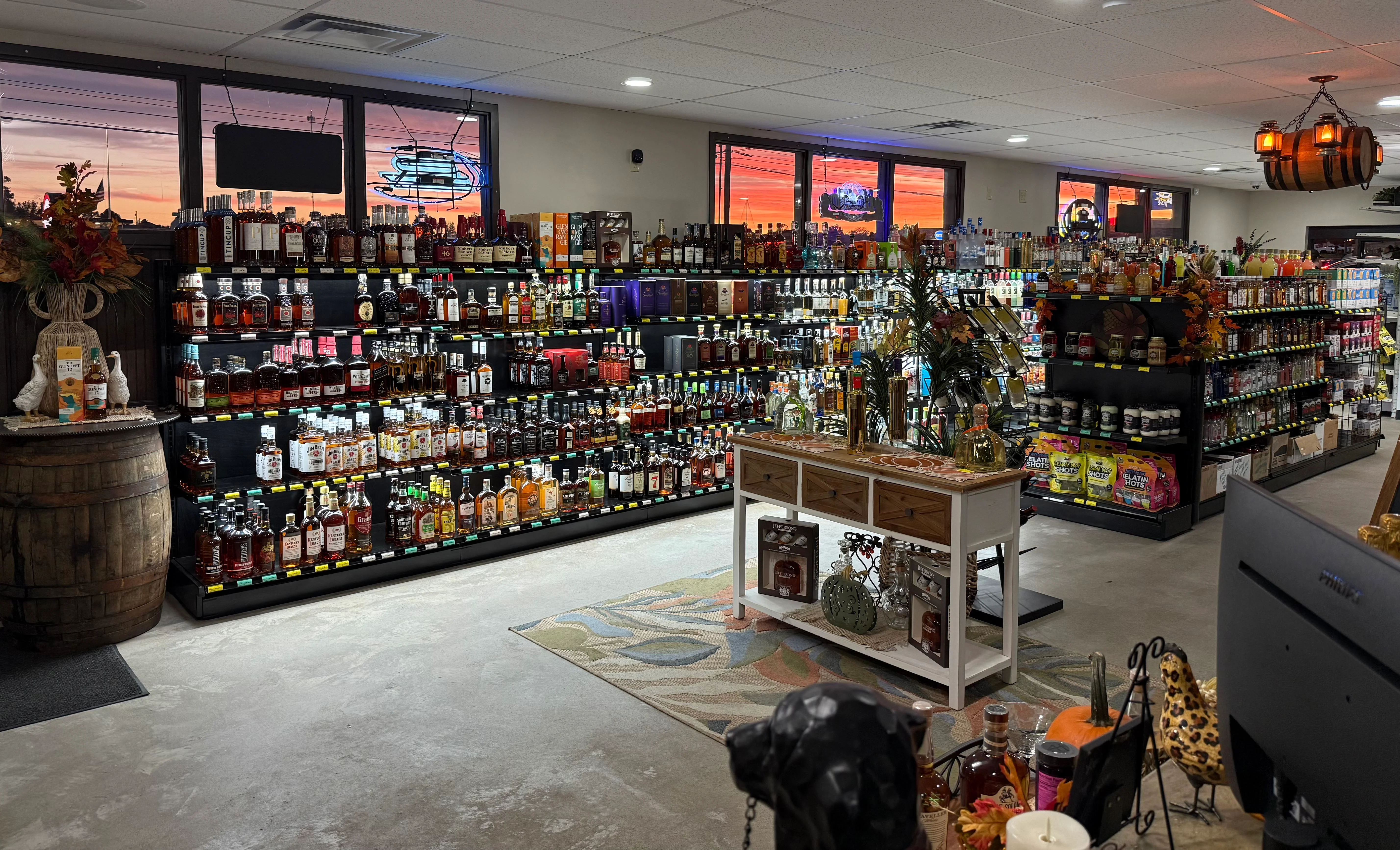 Well-stocked liquor store interior with colorful bottles