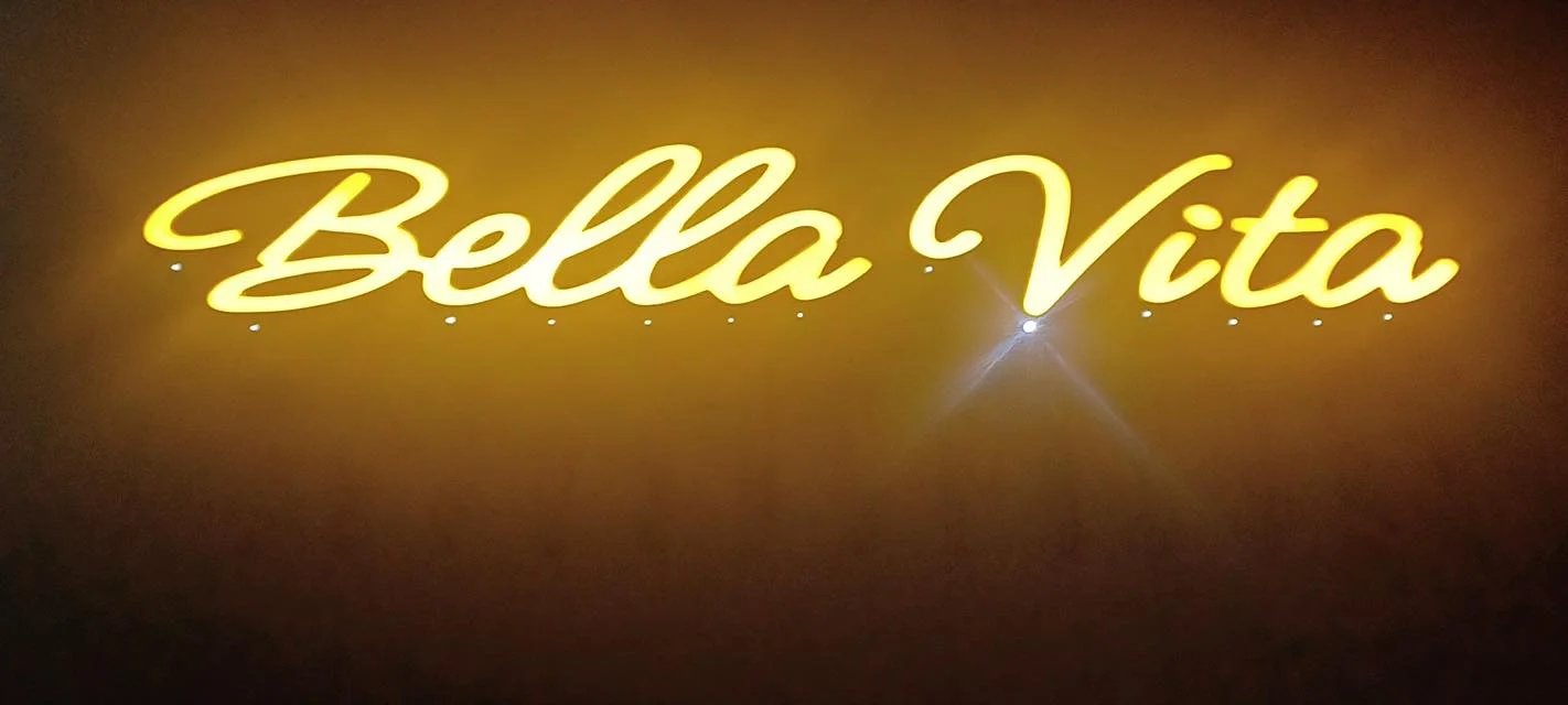 Illuminated restaurant sign for Bella Vita