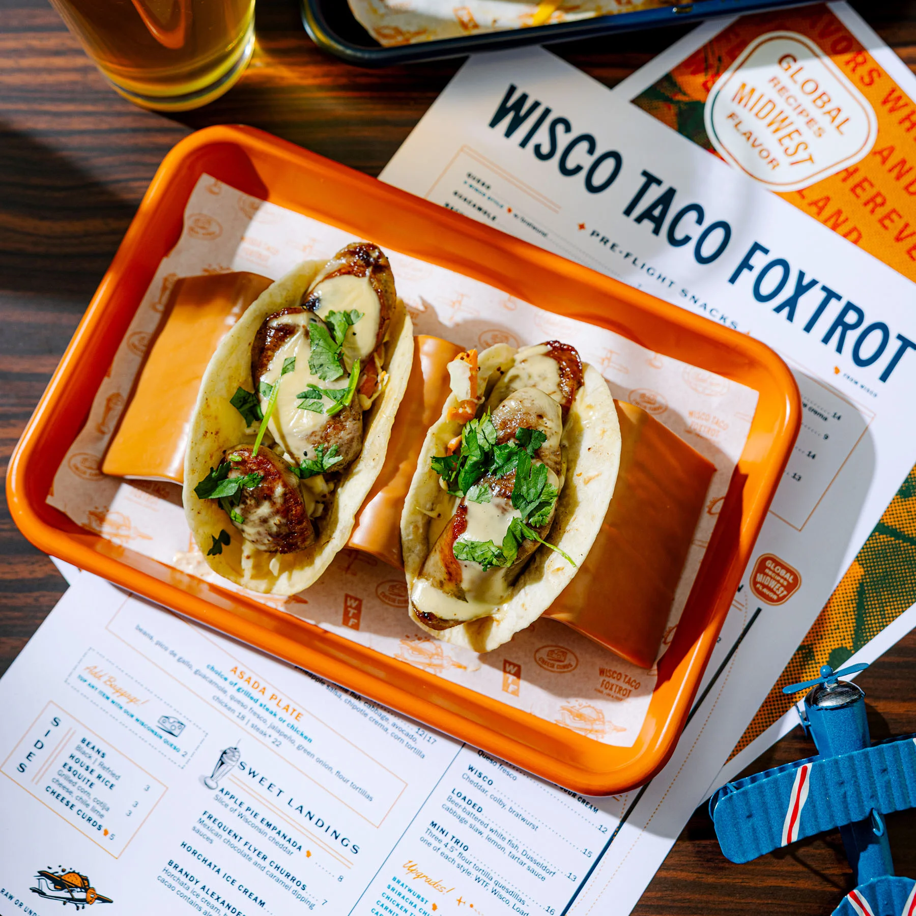 Wisconsin-style tacos with grilled sausage and cilantro