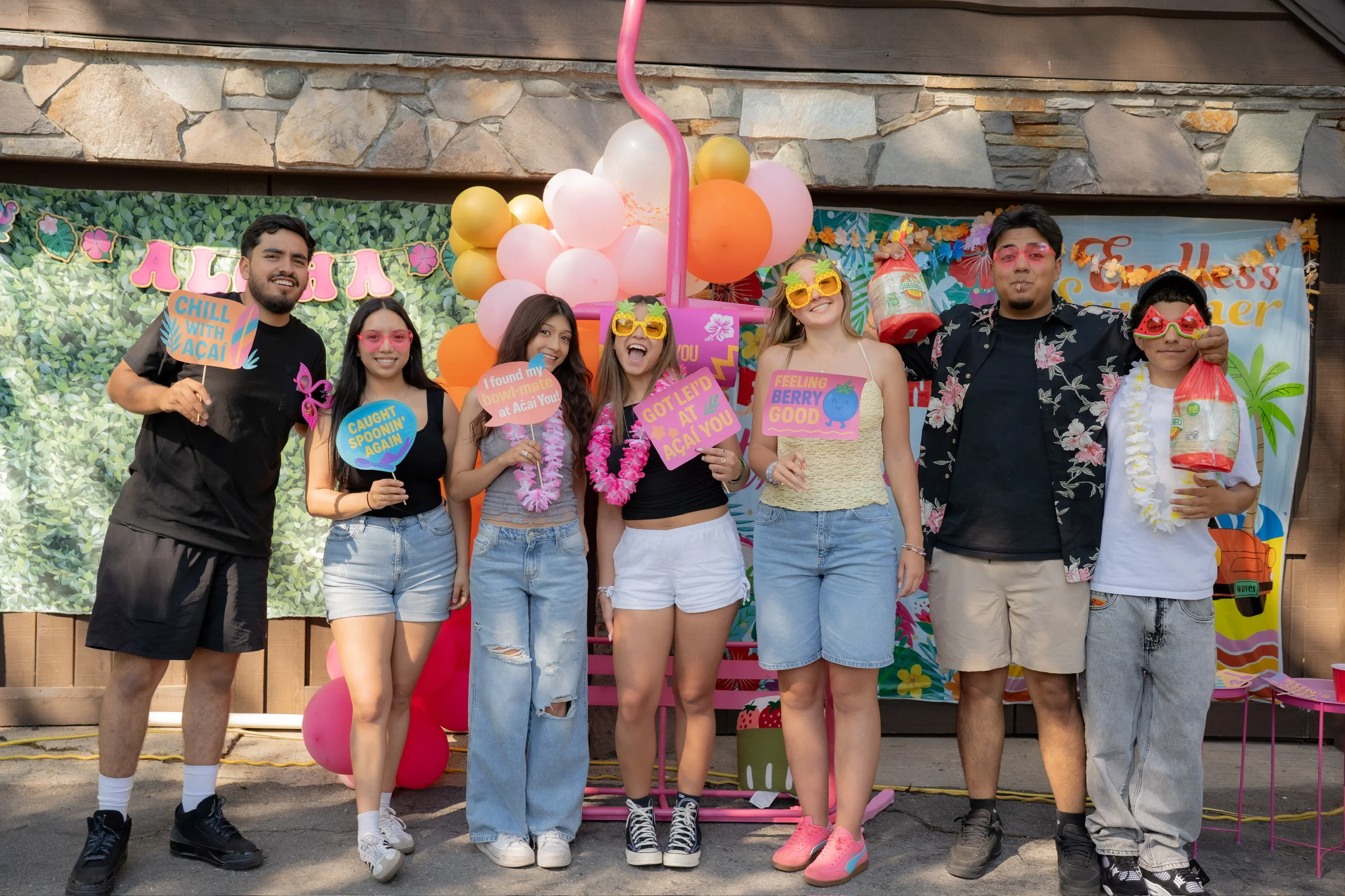 Group of friends celebrating at a vibrant summer-themed event